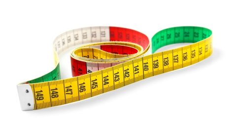 Measuring tape on white background