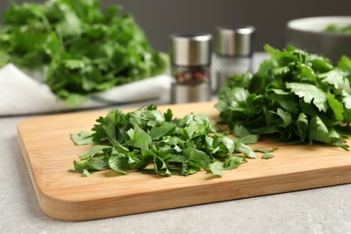 Fresh green  cilantro on light grey table, closeup