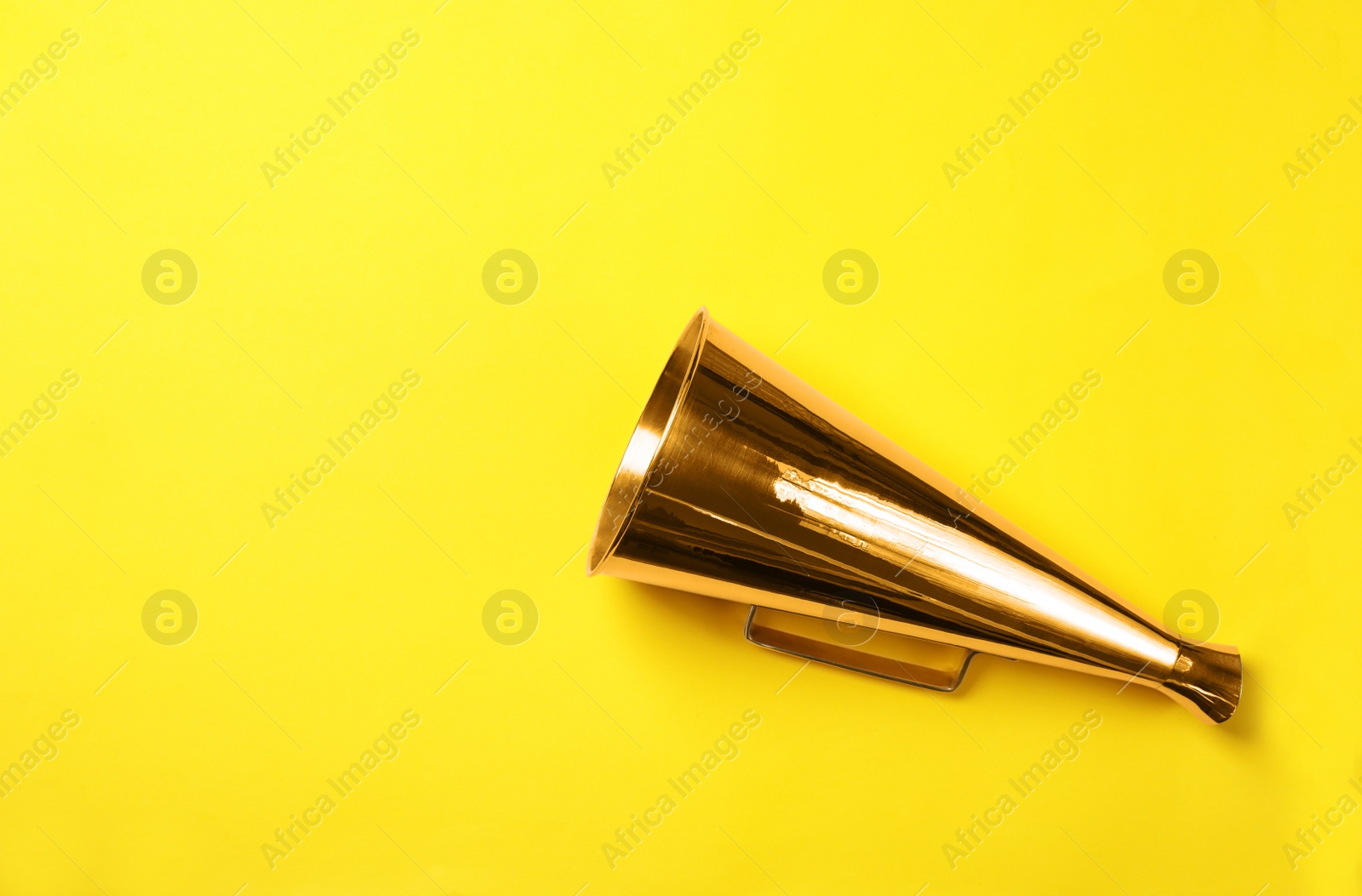 Photo of Retro megaphone on color background