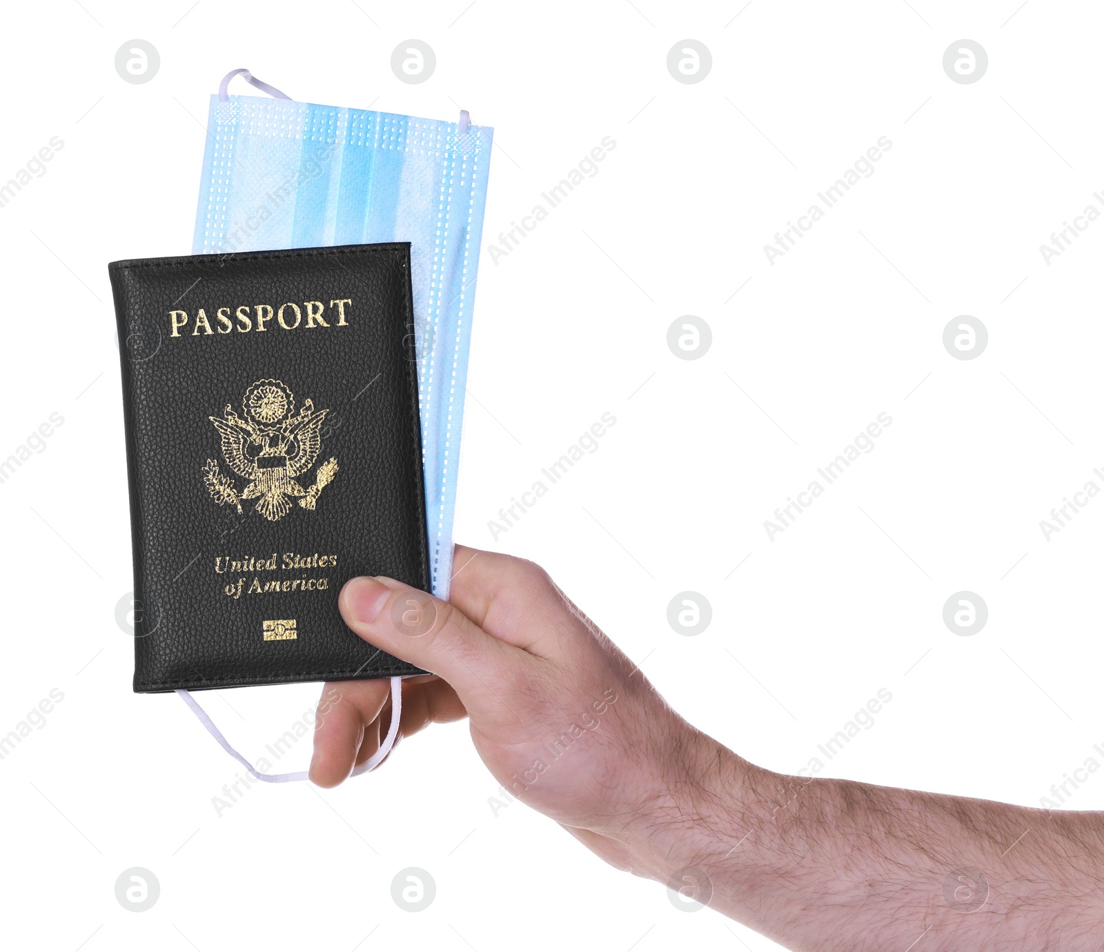 Photo of Man holding passport and protective mask on white background, closeup. Travel during quarantine