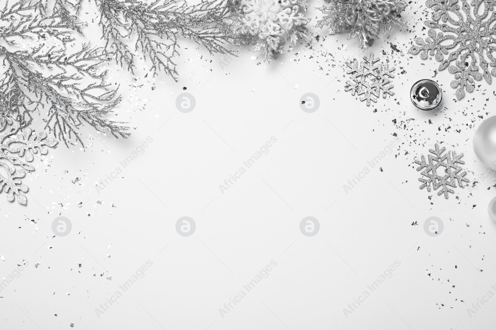 Photo of Baubles, snowflakes and decorative branches on white background, flat lay with space for text. Happy New Year