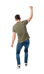 Photo of Young man in casual clothes posing on white background