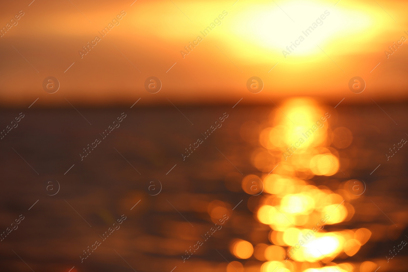 Photo of Blurred view of sea and sky at sunset