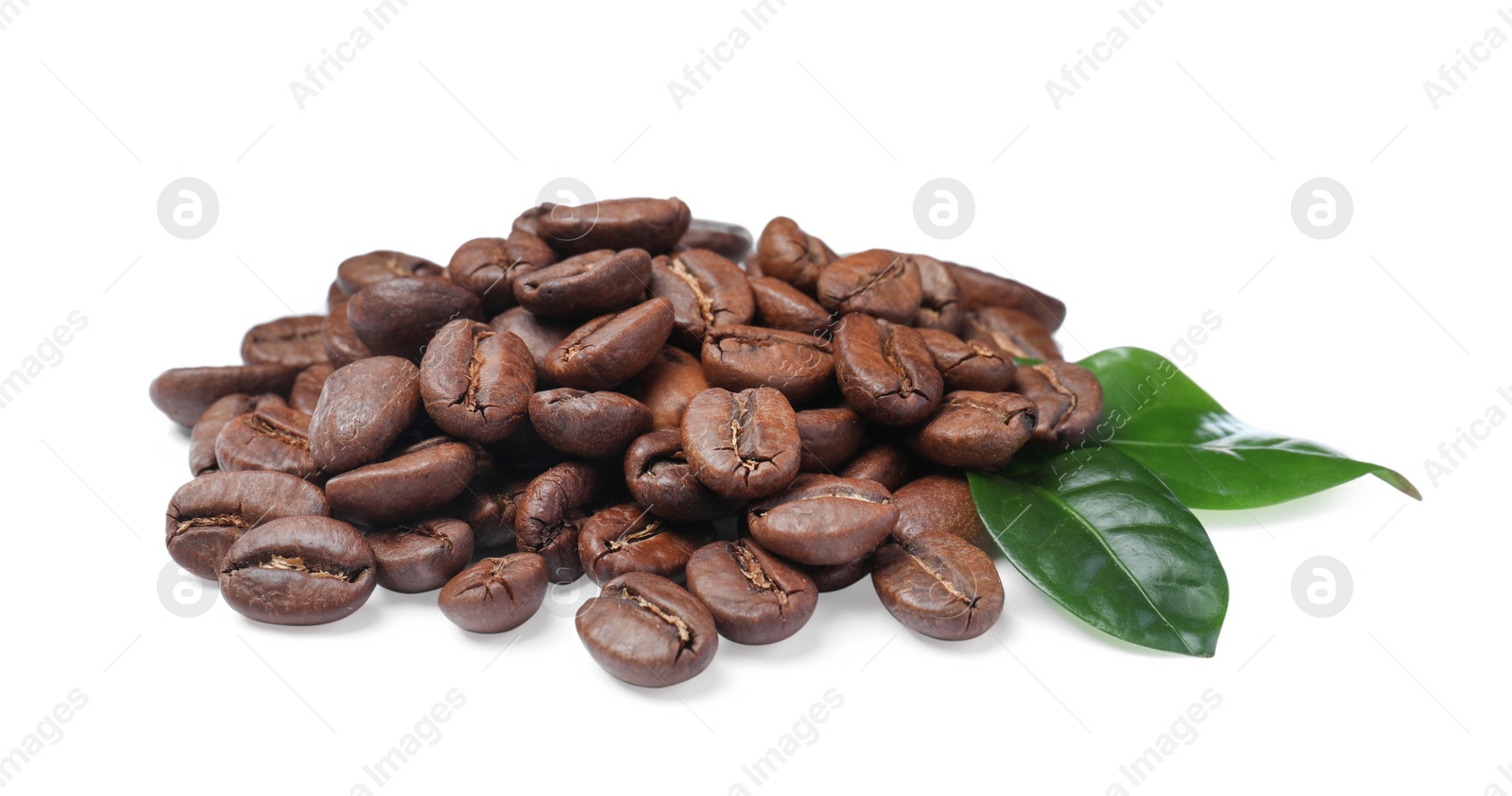 Photo of Pile of roasted coffee beans with fresh leaves on white background