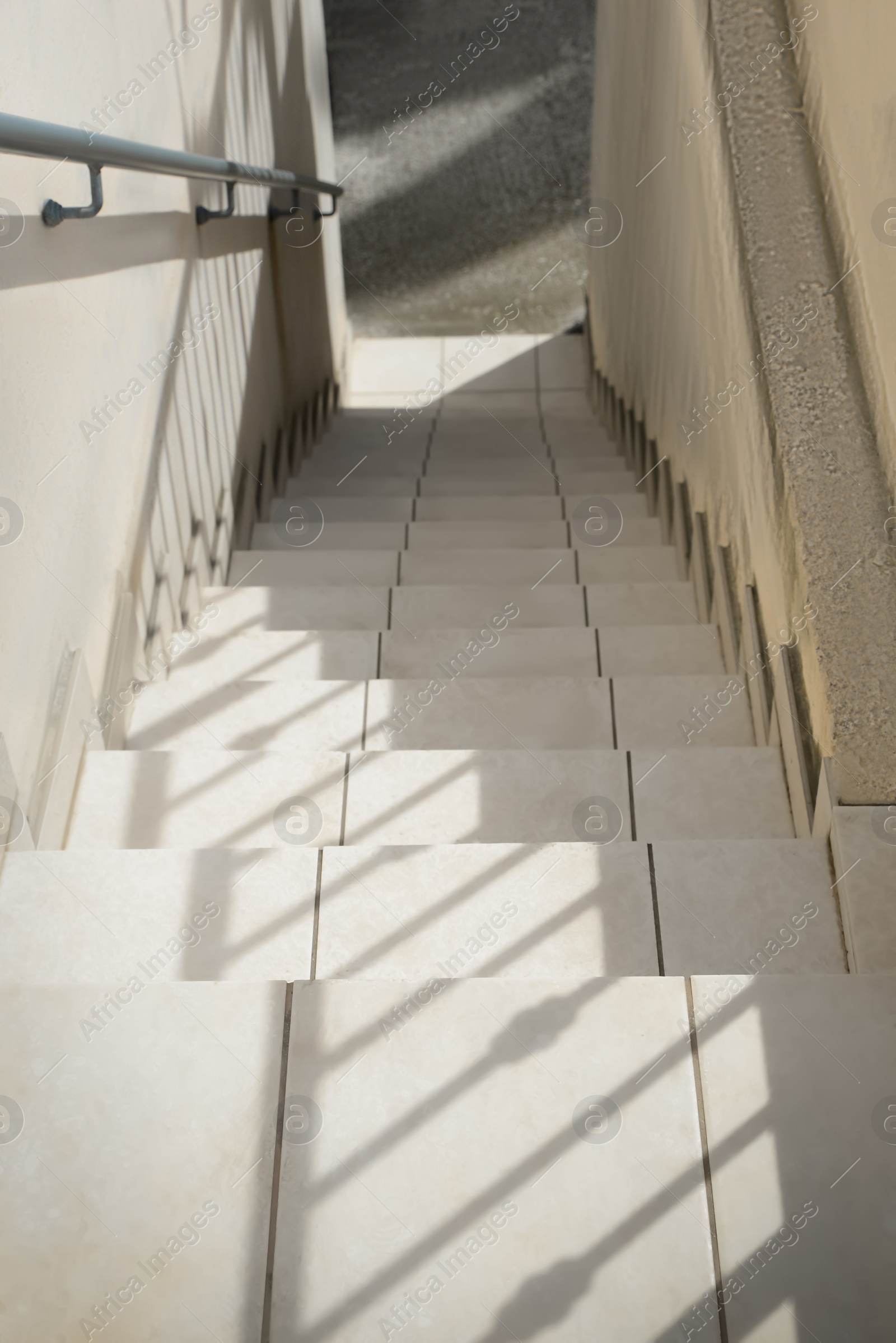 Photo of Staircase leading to exit of house outdoors, above view