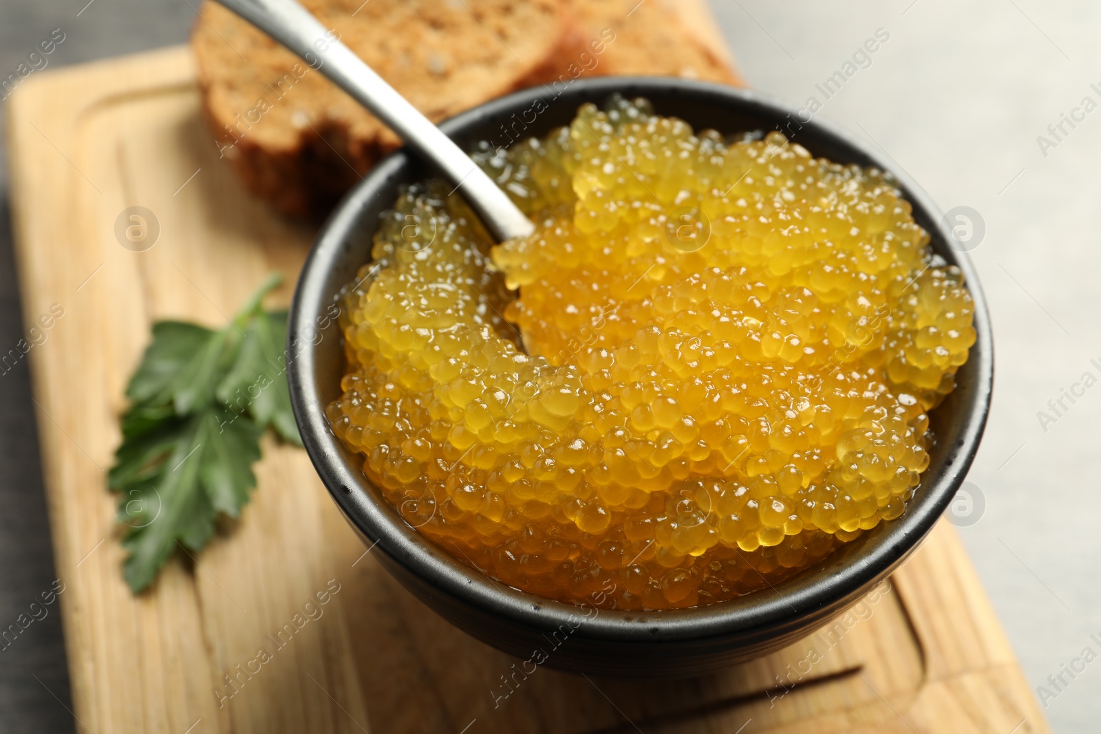 Photo of Fresh pike caviar in bowl on table, closeup