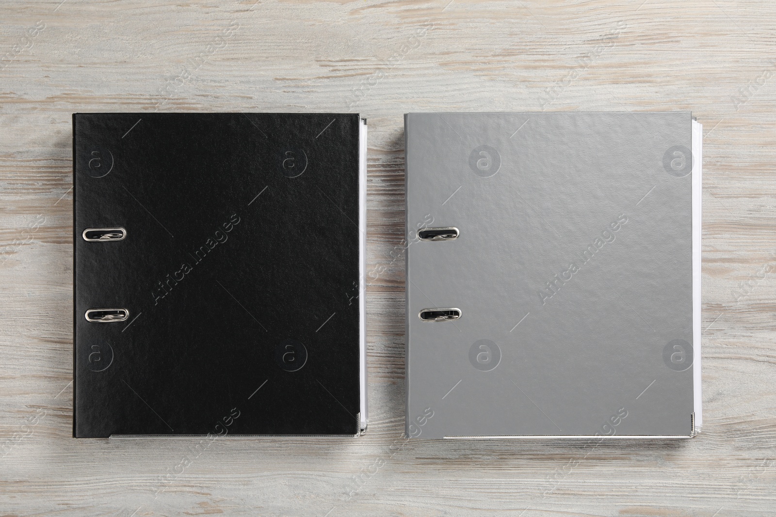 Photo of Office folders on wooden table, flat lay