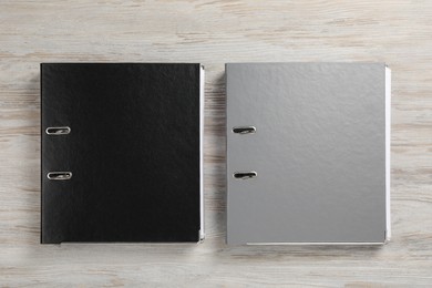 Photo of Office folders on wooden table, flat lay