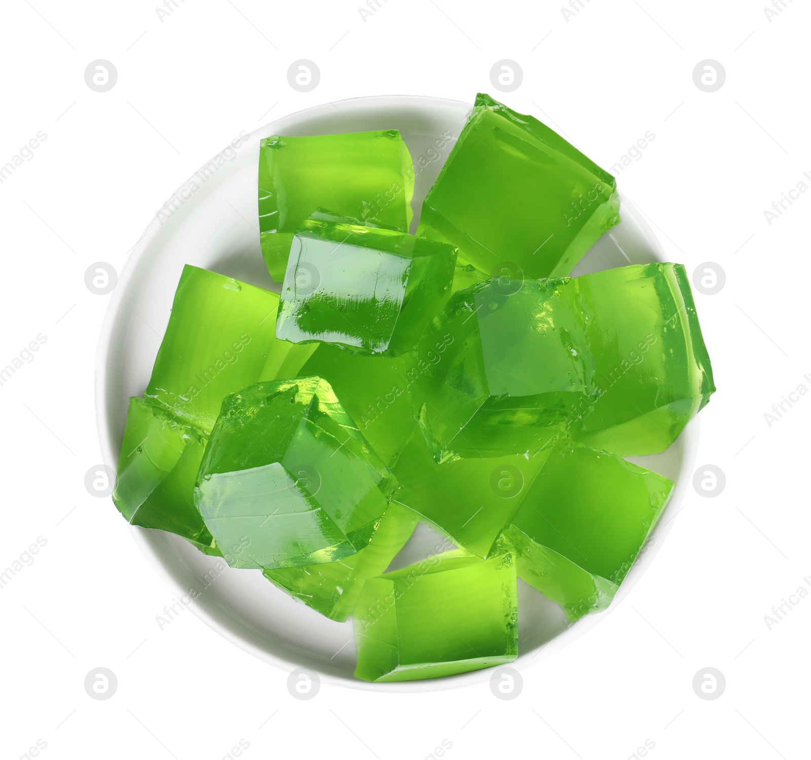 Photo of Plate with green jelly cubes on white background, top view