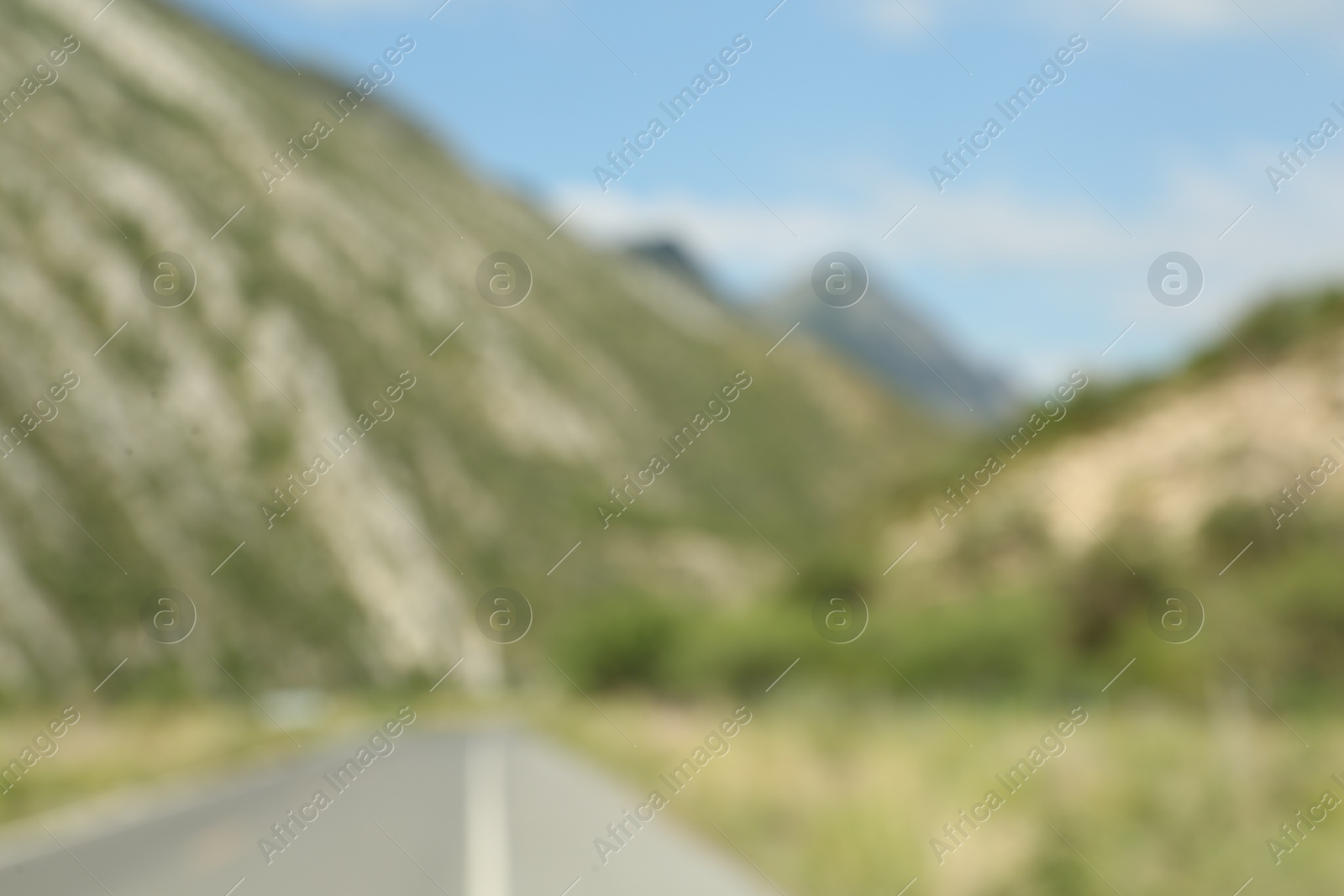 Photo of Blurred view of high mountains under sky outdoors