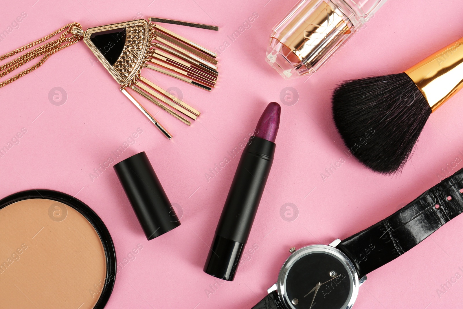 Photo of Flat lay composition with bright lipstick and accessories on pink background