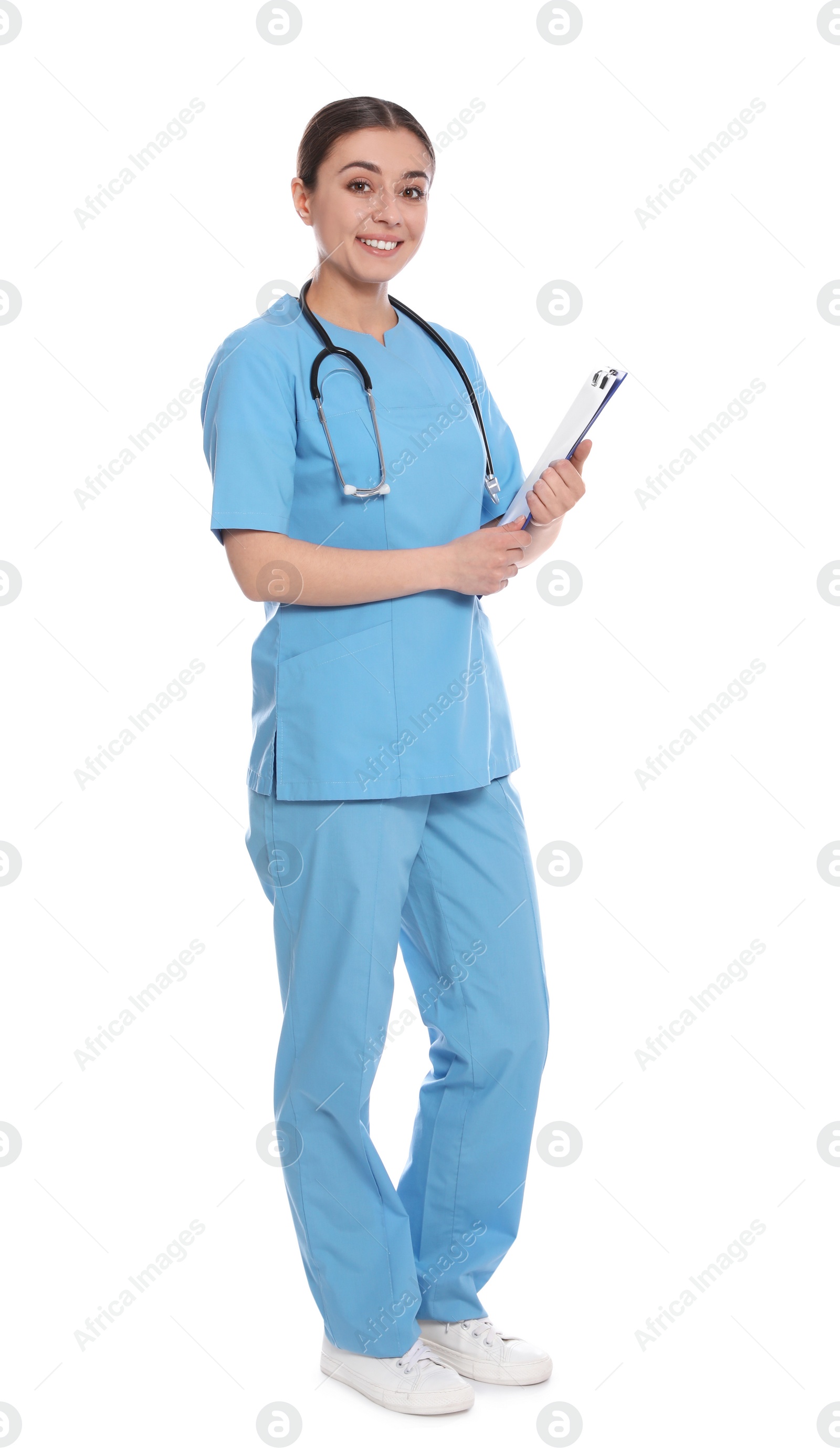 Photo of Full length portrait of medical doctor with clipboard and stethoscope isolated on white