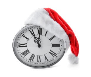 Photo of Clock with Santa hat on white background. Christmas countdown