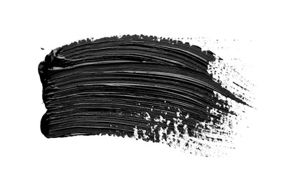 Photo of Brushstrokes of black oil paint on white background, top view