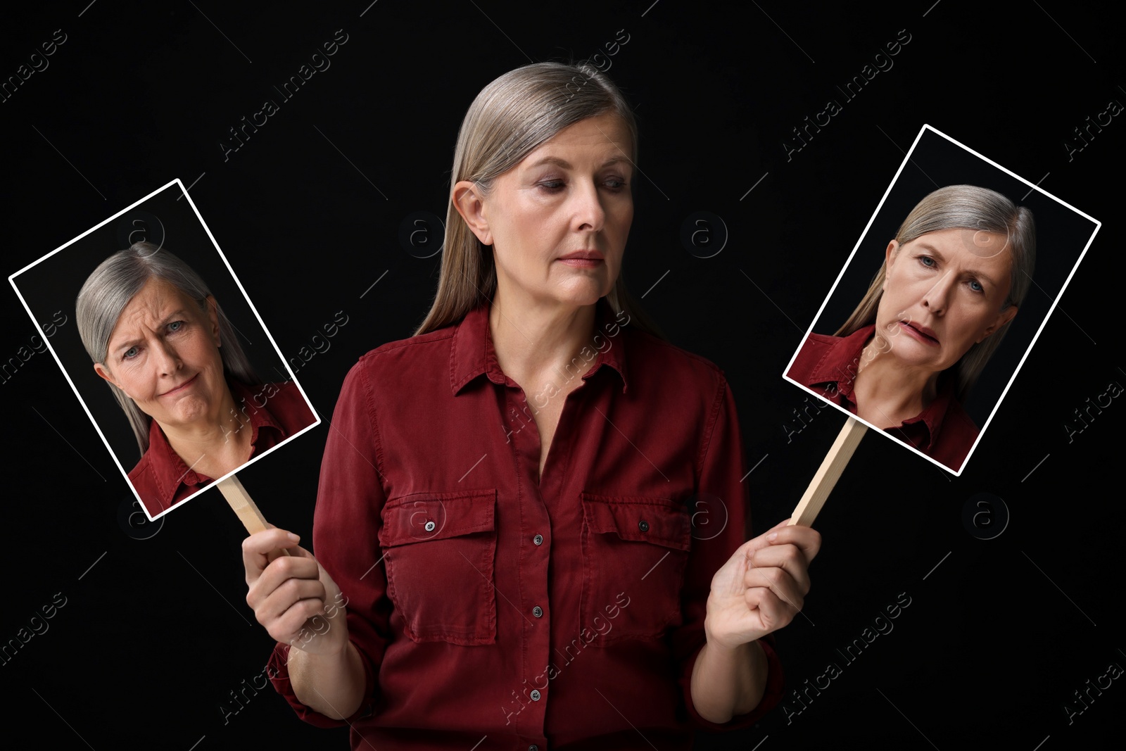 Image of Mature woman holding her photo portraits showing different emotions on black background. Balanced personality