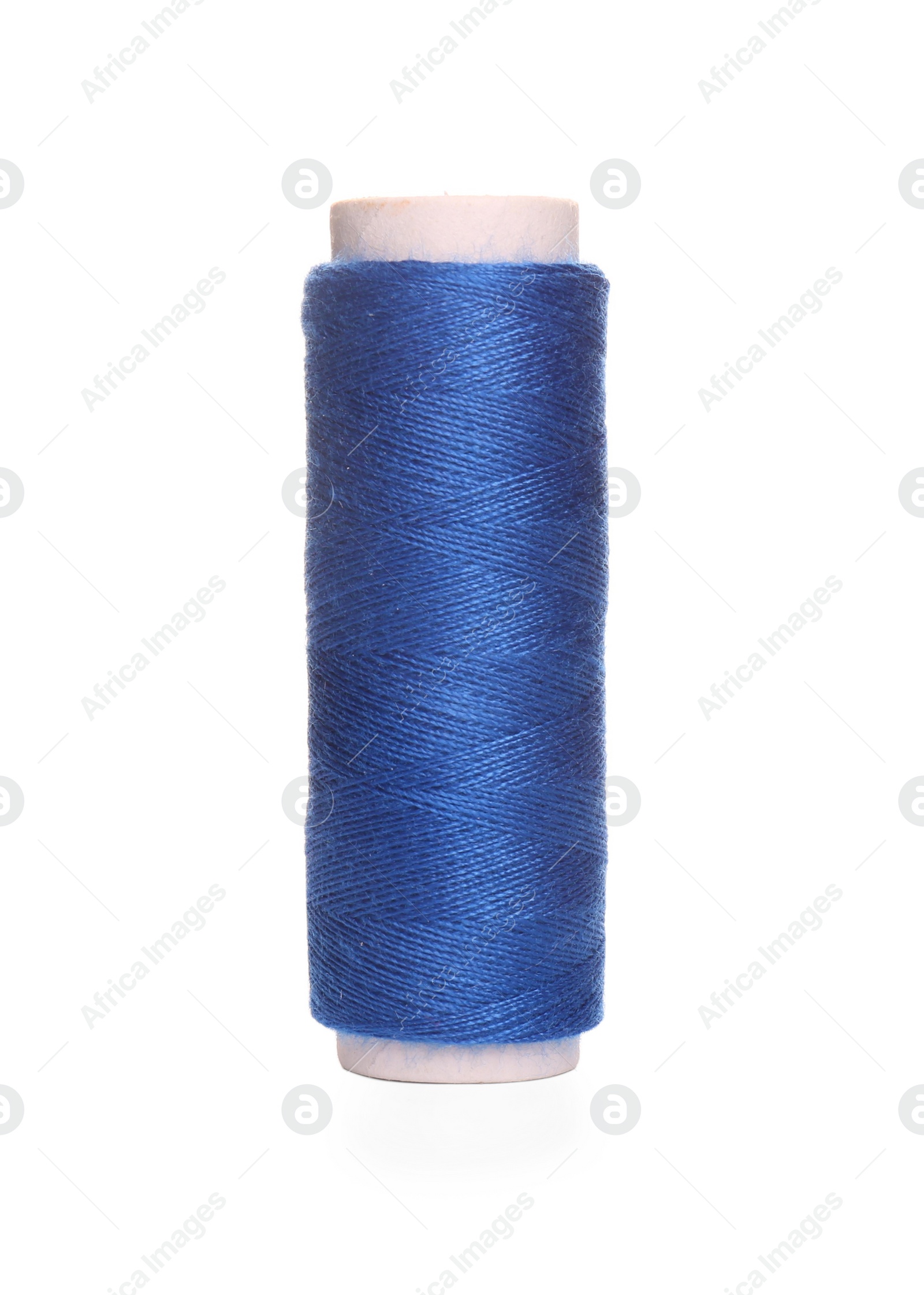 Photo of Spool of blue sewing thread isolated on white