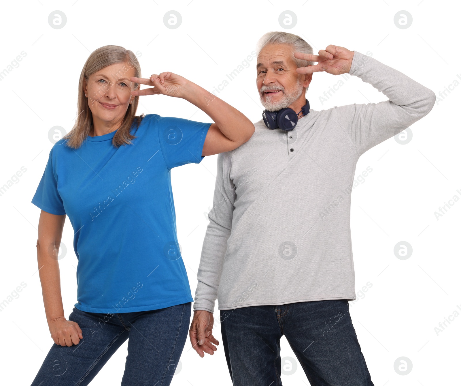 Photo of Senior couple dancing together on white background