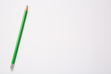 Photo of Sharp graphite pencil on white background, top view. Space for text