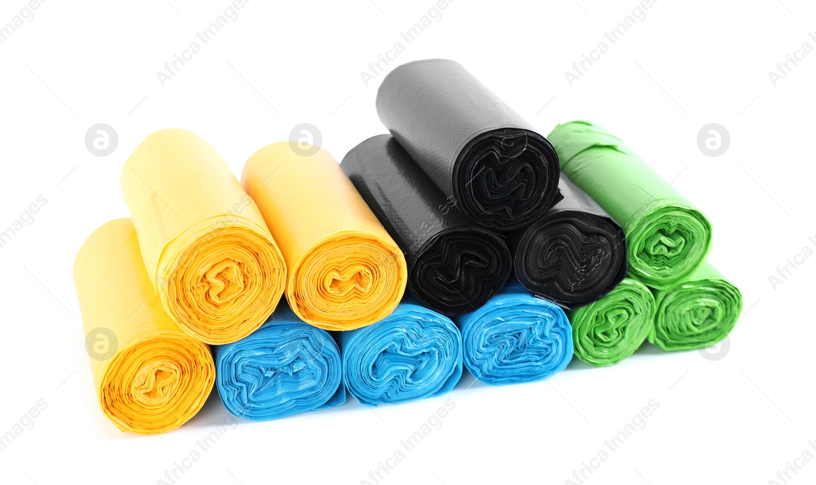 Photo of Rolls of colorful garbage bags isolated on white