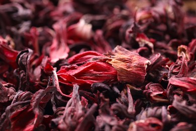 Photo of Dry hibiscus tea as background, closeup view