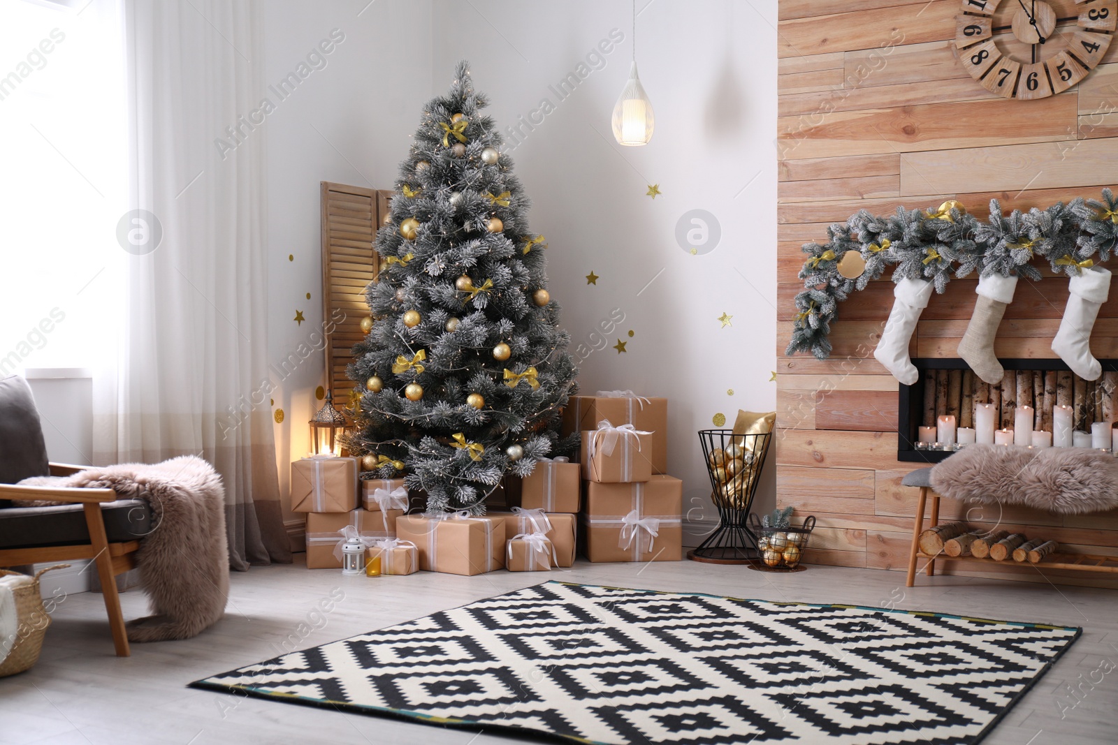 Photo of Stylish room interior with beautiful Christmas tree and decorative fireplace