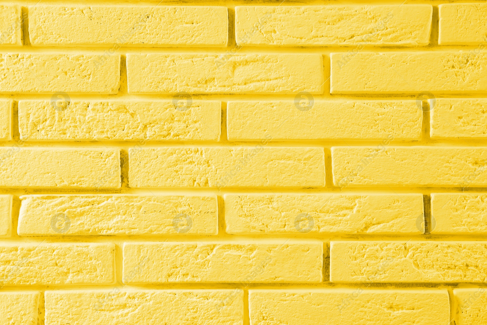 Image of Stylish yellow brick wall as background. Simple design