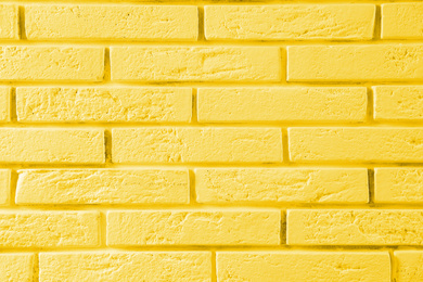 Image of Stylish yellow brick wall as background. Simple design