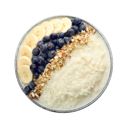 Delicious rice pudding with banana, blueberries and almond isolated on white, top view