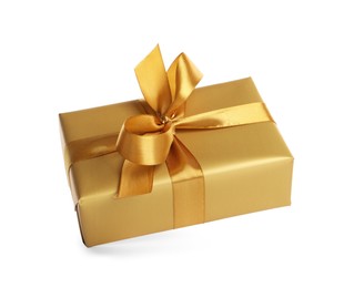 Gift box with golden ribbon and bow on white background
