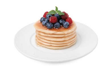 Photo of Delicious pancakes with berries, mint and honey isolated on white