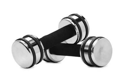 Photo of Metal dumbbells isolated on white. Sports equipment