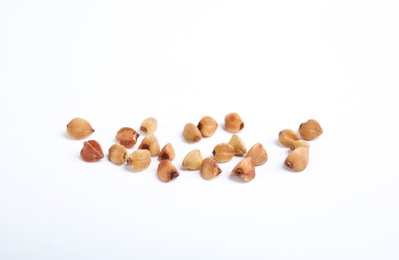 Photo of Uncooked buckwheat on white background. Healthy diet