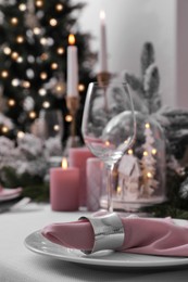 Beautiful festive table setting with Christmas decor indoors