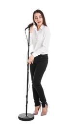 Photo of Young stylish woman with microphone on white background