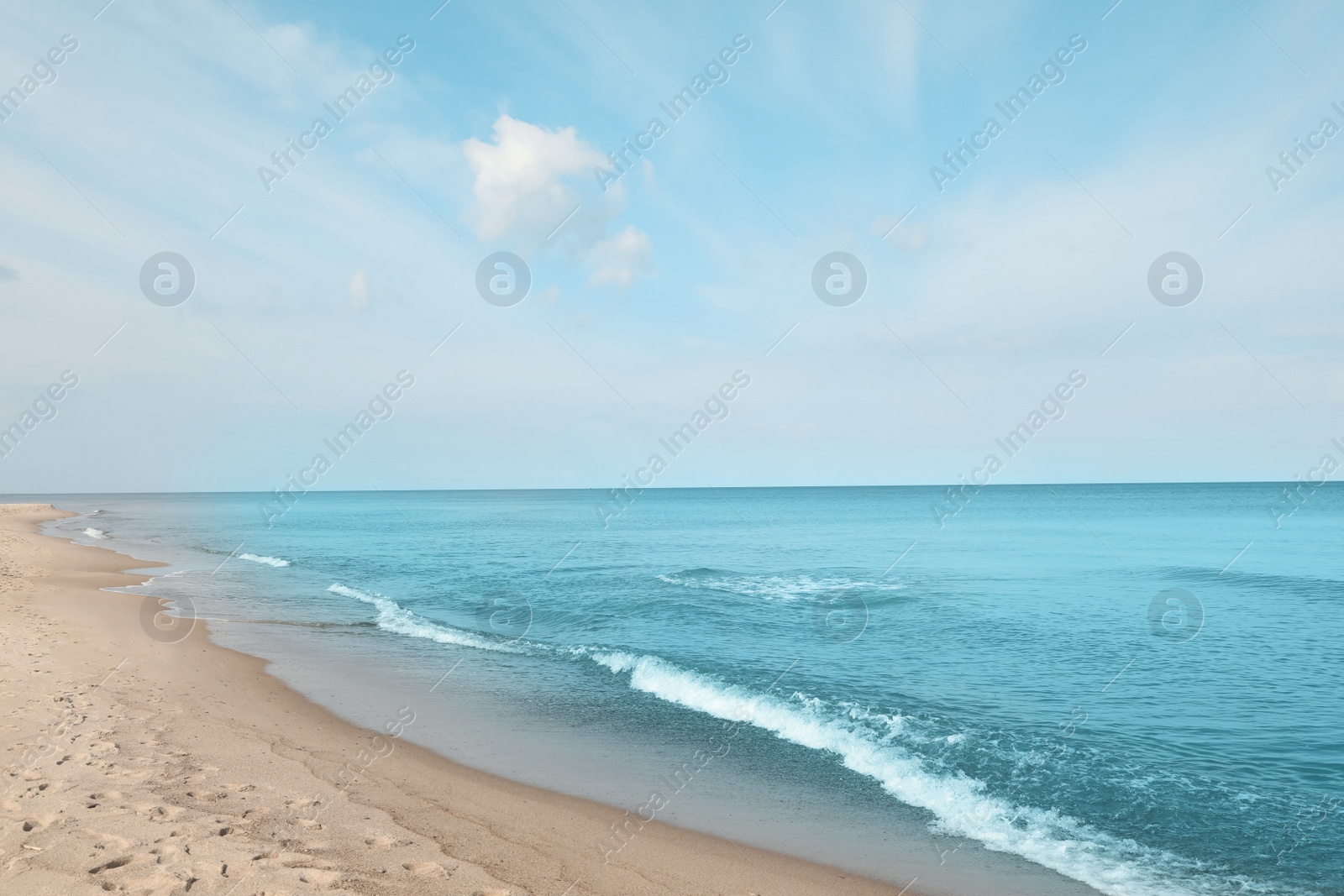 Photo of Beautiful view of sea shore under blue sky on sunny day