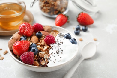 Photo of Tasty homemade granola served on table. Healthy breakfast