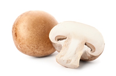 Photo of Fresh raw champignon mushrooms on white background