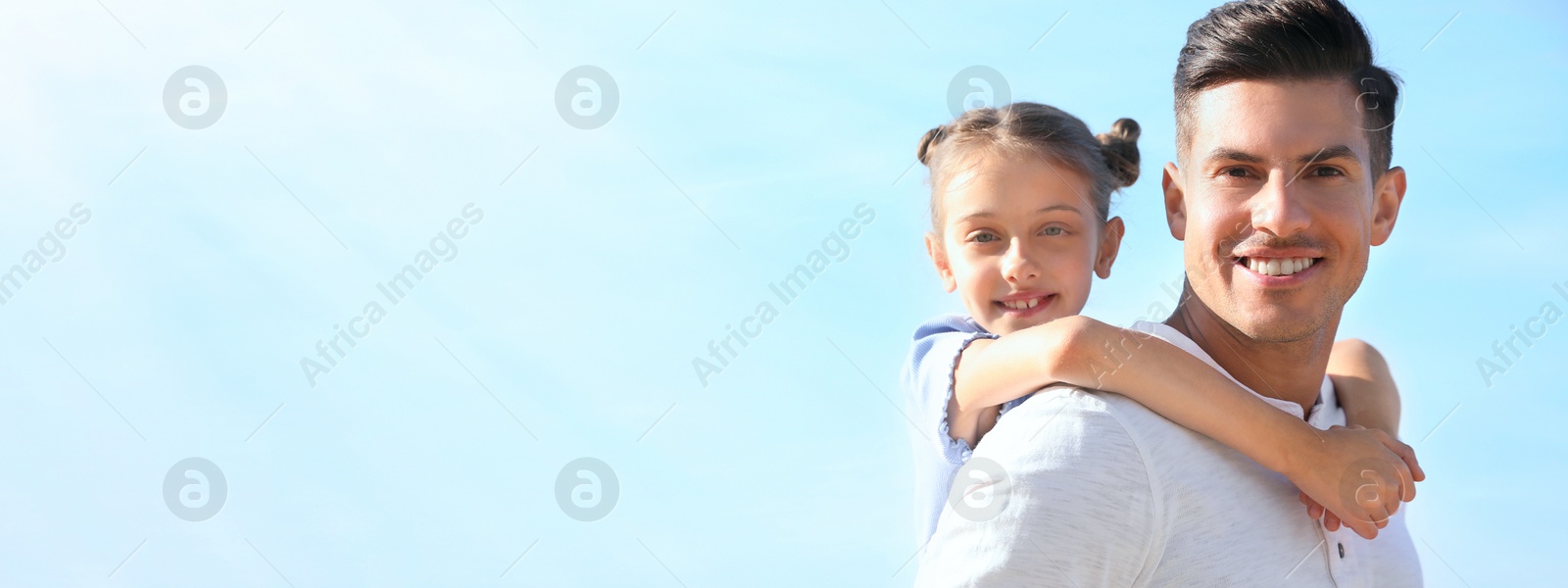 Image of Father and daughter having fun outdoors, space for text. Banner design
