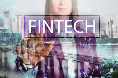 Image of Fintech concept. Double exposure of cityscape and businesswoman, closeup