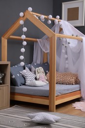 Photo of Stylish child room interior with comfortable bed