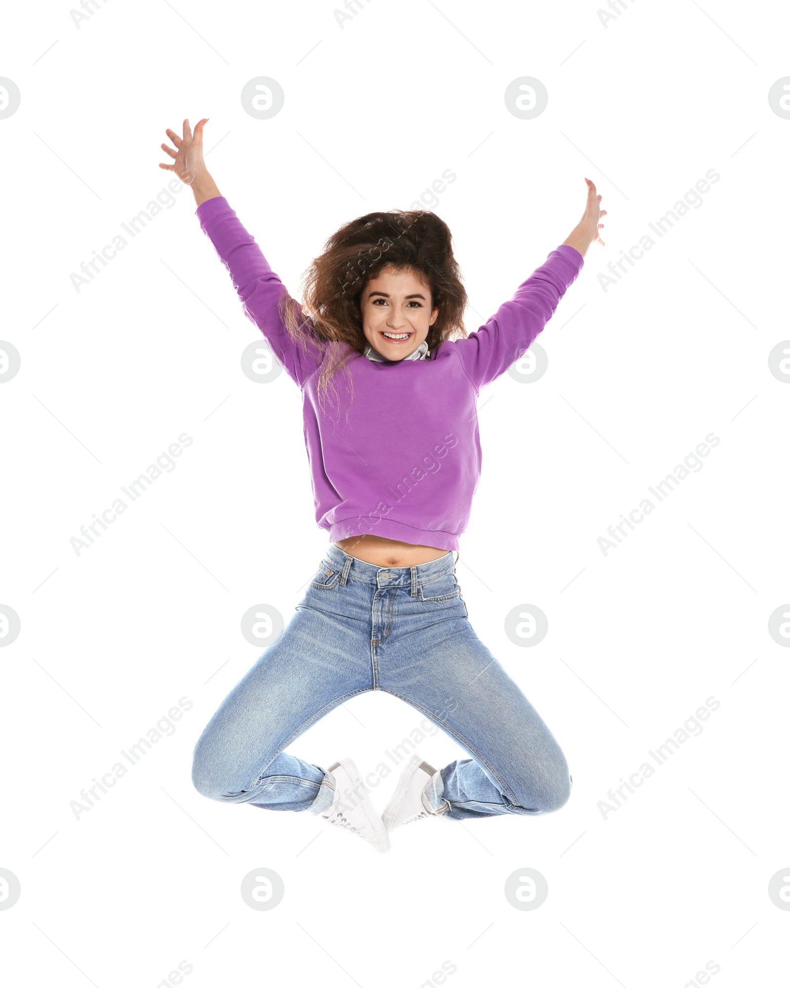 Photo of Beautiful young woman in stylish clothes jumping on white background