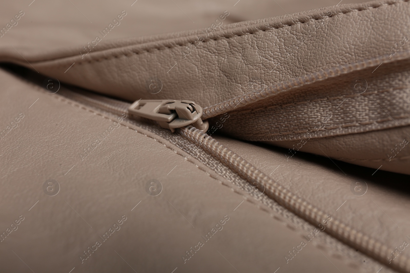 Photo of Pink leather jacket with zipper as background, closeup view