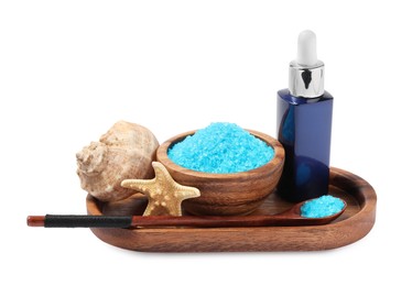 Light blue sea salt in bowl, shell, starfish and cosmetic product isolated on white