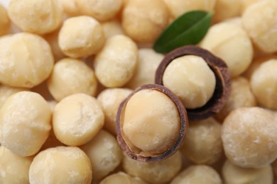 Tasty peeled Macadamia nuts as background, closeup