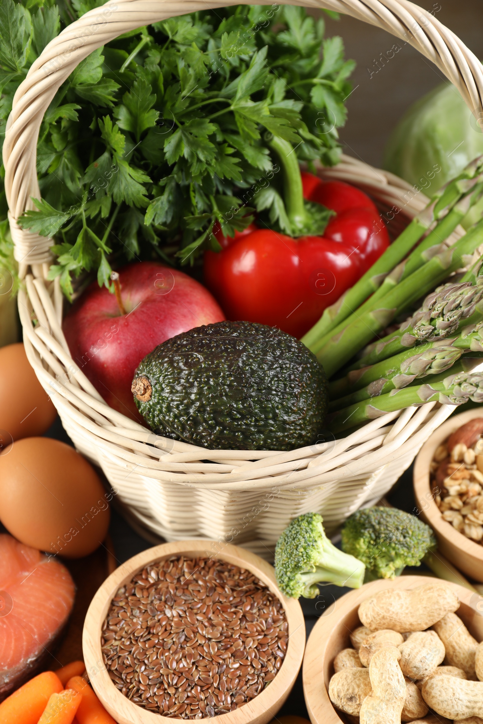 Photo of Healthy food. Basket with different fresh products on table