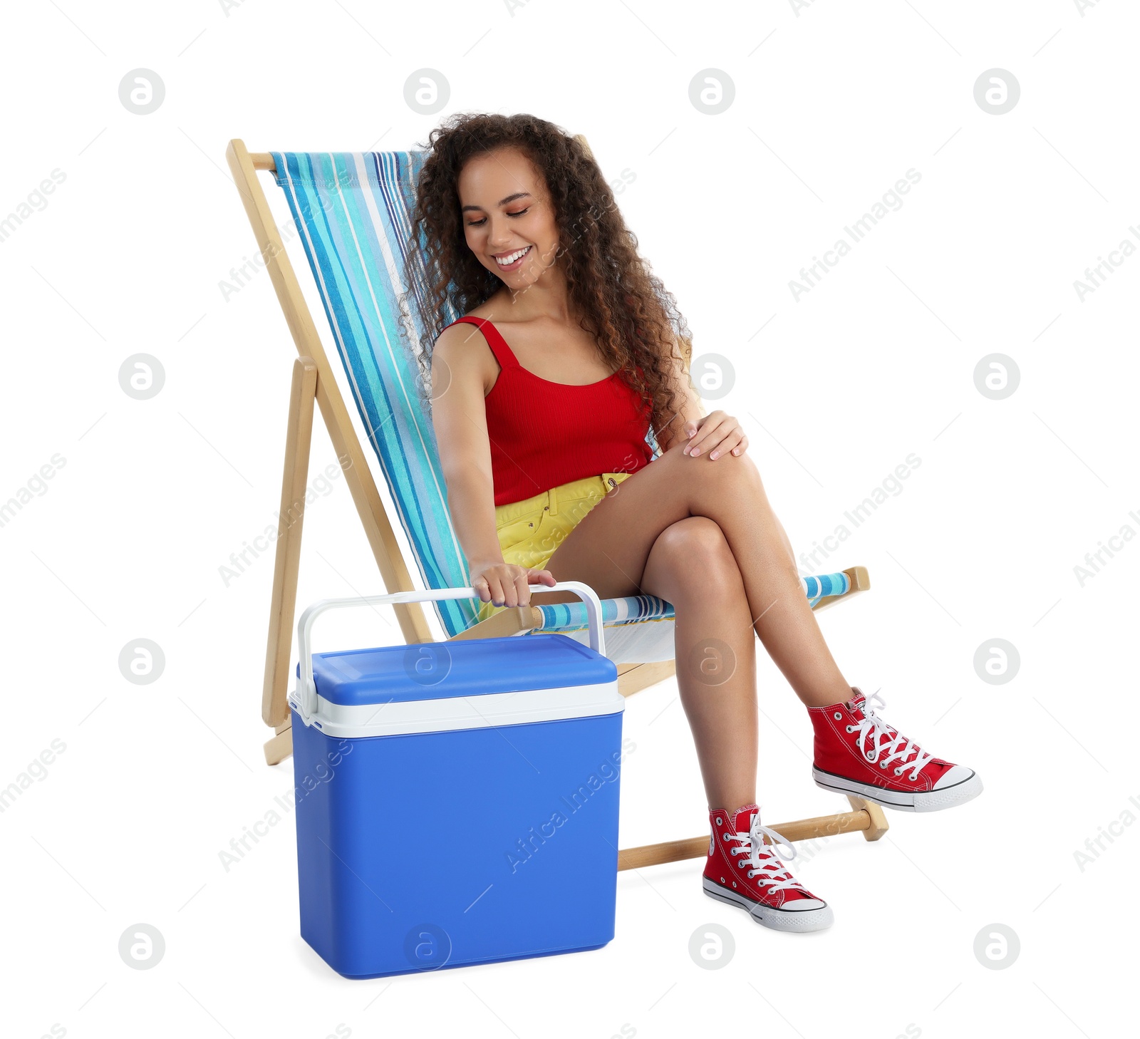 Photo of Happy young African American woman with cool box on white background