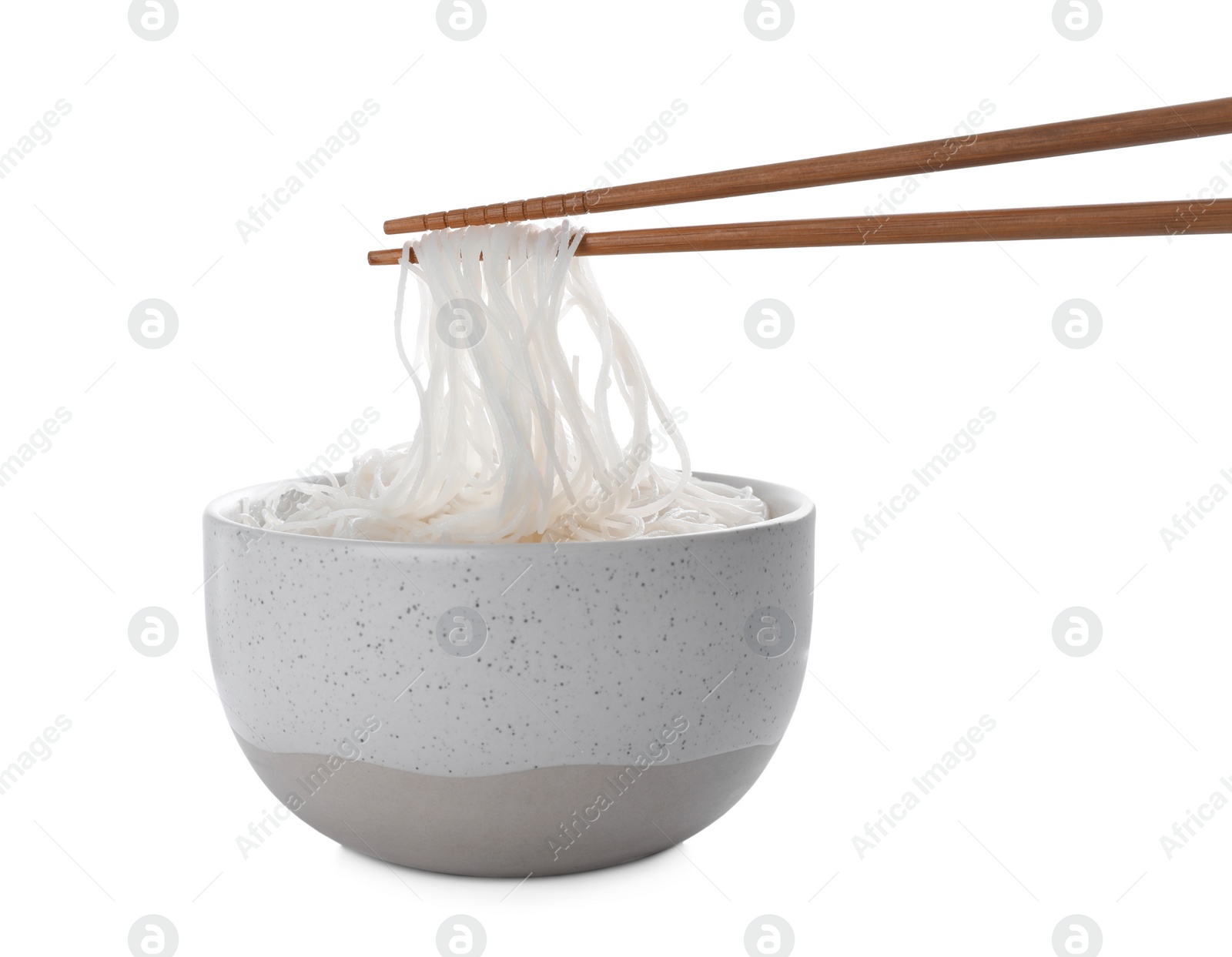 Photo of Chopsticks with cooked rice noodles over bowl isolated on white