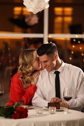 Photo of Lovely couple having romantic dinner on Valentine's day in restaurant