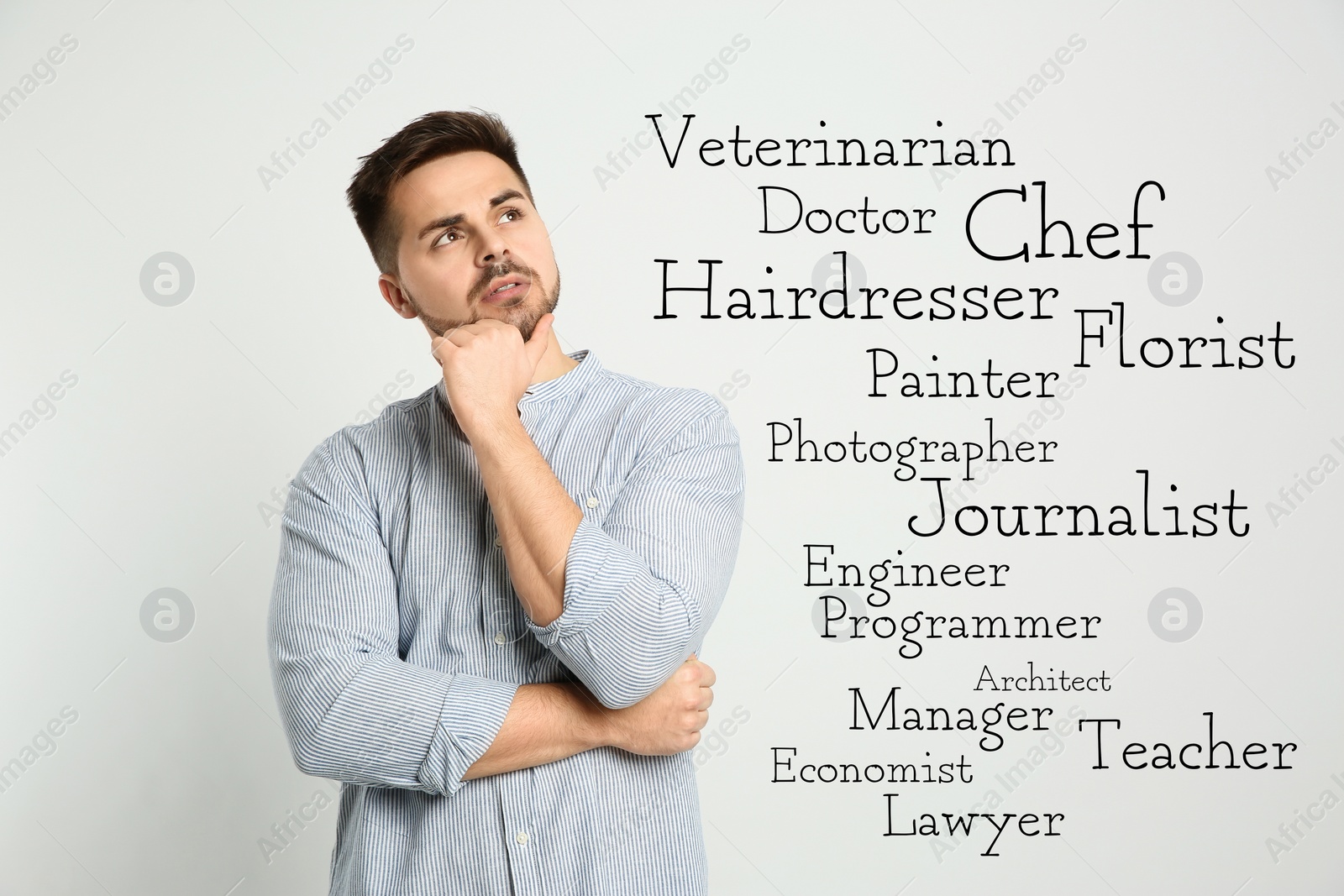 Image of Thoughtful young man choosing profession on light background