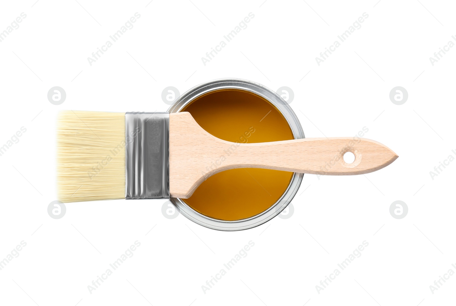 Photo of Can of yellow paint with brush isolated on white, top view